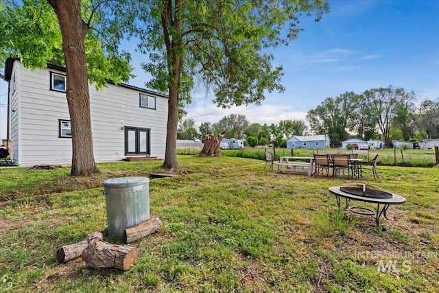 5009 Airport Rd, Nampa, ID 83687 - view of grassy yard featuring an outdoor fire pit