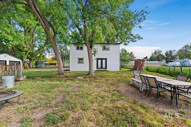 5009 Airport Rd, Nampa, ID 83687 - view of yard featuring french doors, an outbuilding, and outdoor dining space