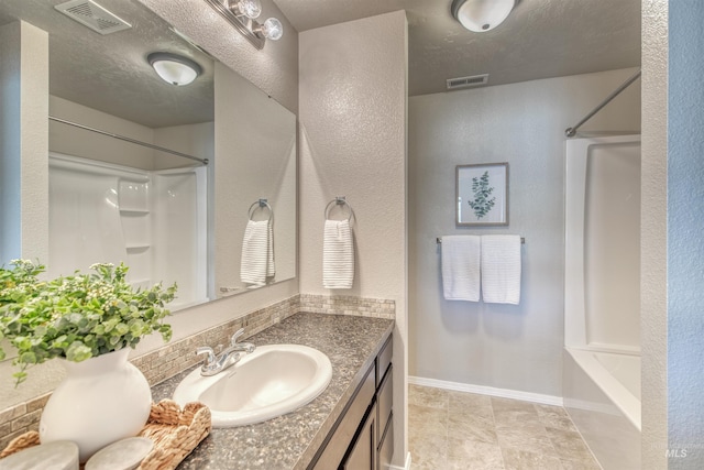 bathroom featuring vanity, shower / bathing tub combination, and visible vents
