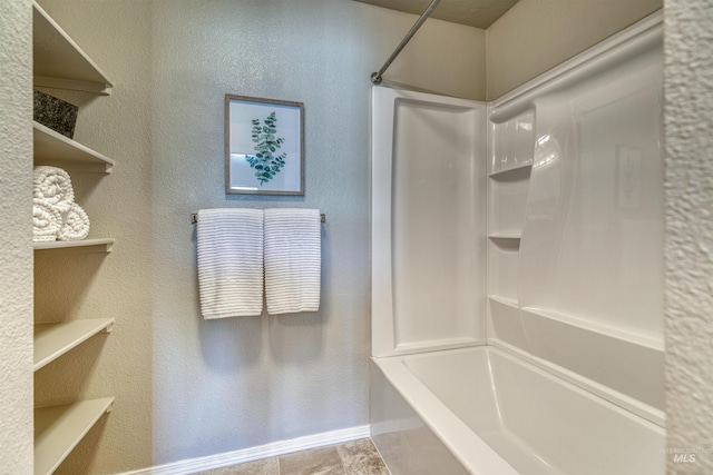 full bathroom with baseboards and shower / washtub combination