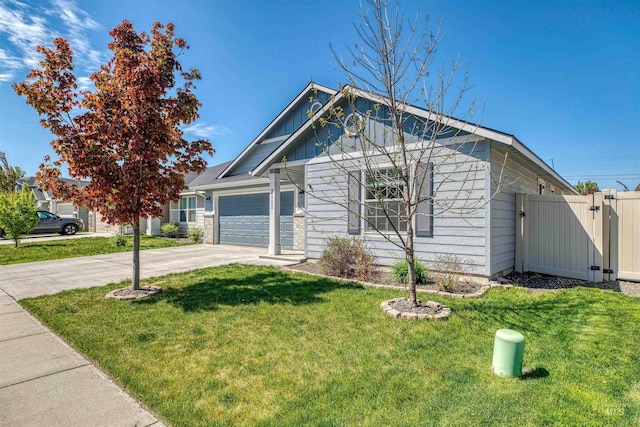 view of front of house with an attached garage, driveway, and a front yard