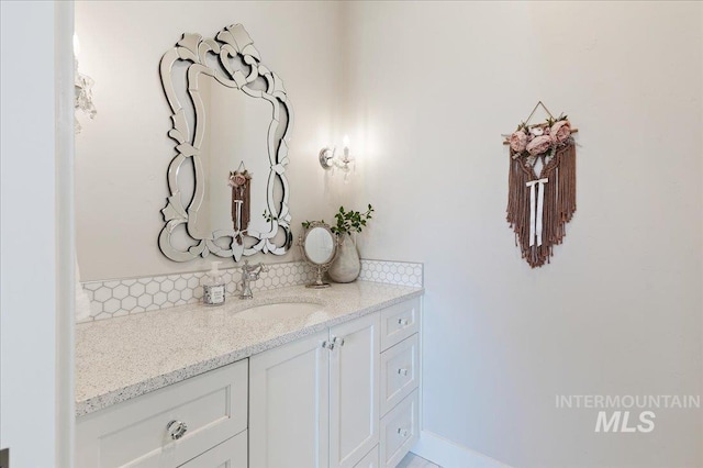 bathroom featuring backsplash and vanity