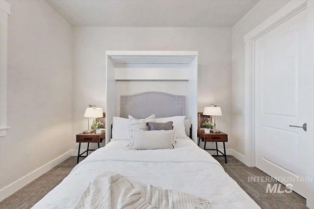 carpeted bedroom featuring baseboards