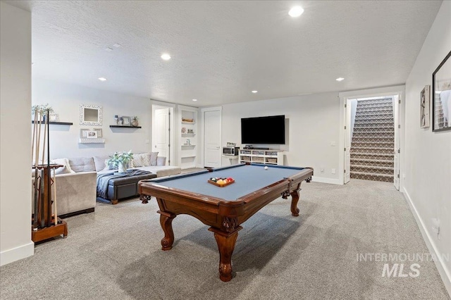 game room featuring recessed lighting, light colored carpet, and a textured ceiling