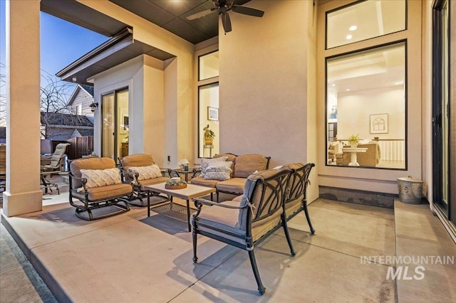 view of patio featuring an outdoor living space and a ceiling fan