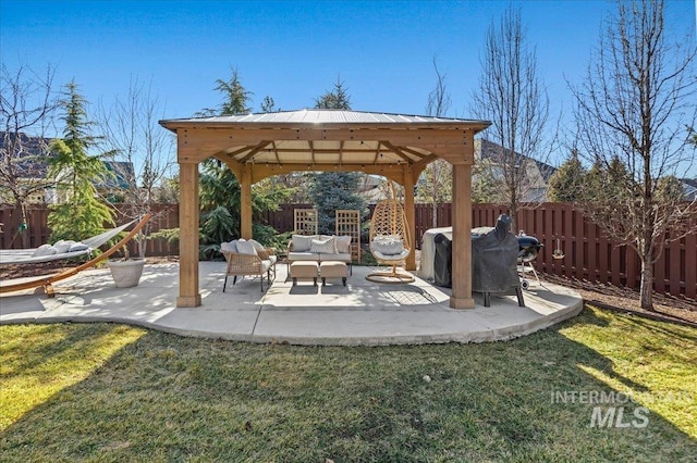 view of patio with a fenced backyard, a grill, an outdoor living space, and a gazebo