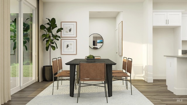 dining area featuring dark hardwood / wood-style floors