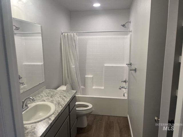 full bathroom featuring shower / bath combo, vanity, toilet, and wood finished floors