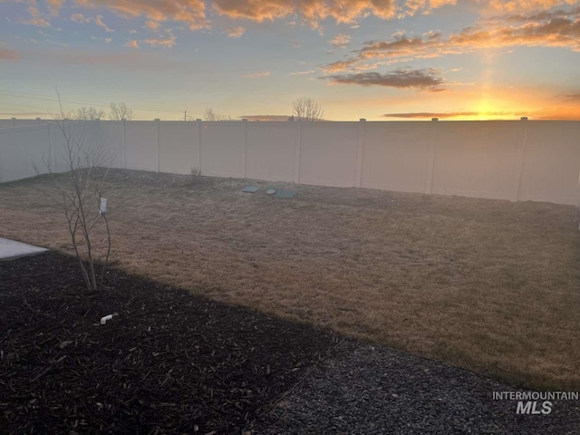 view of yard with a fenced backyard