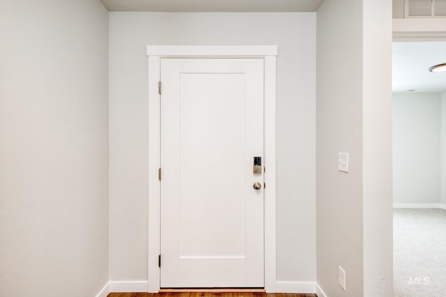 doorway featuring visible vents and baseboards