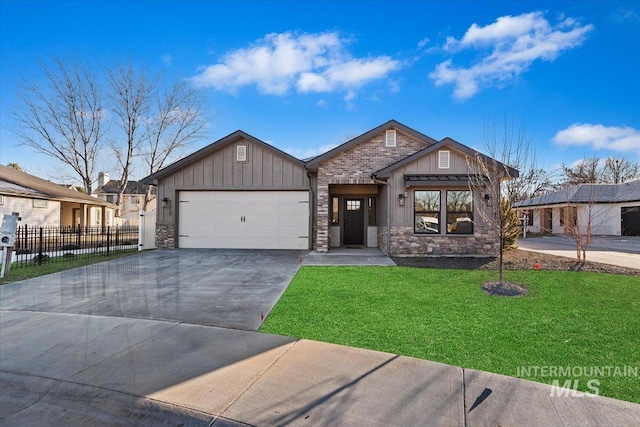 view of front of house with a garage and a front lawn