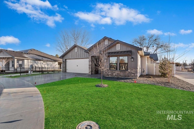 view of front of property with a garage and a front yard