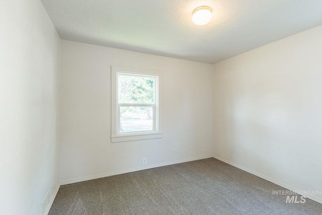 empty room with carpet flooring