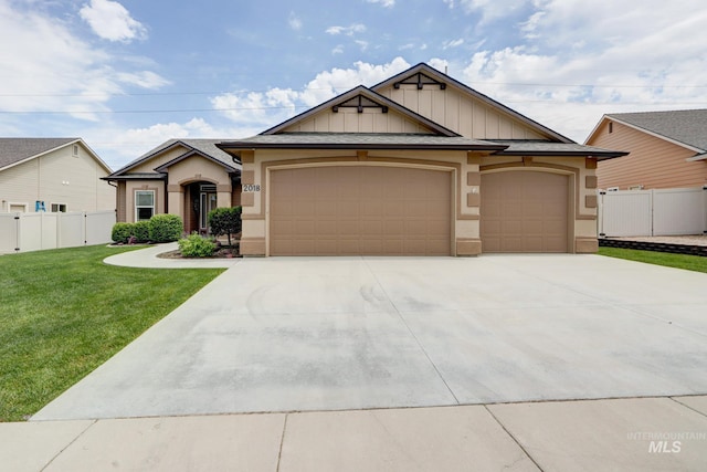 2018 S Sandcrest Loop, Nampa, ID 83686 - view of front of home featuring a garage, driveway, stucco siding, and board and batten siding