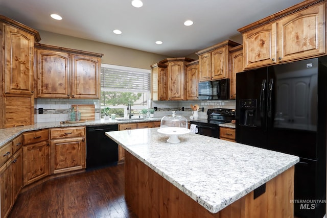 2018 S Sandcrest Loop, Nampa, ID 83686 - kitchen featuring black appliances, dark wood finished floors, backsplash, a kitchen island, and recessed lighting