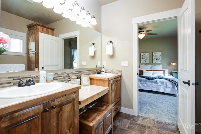 2018 S Sandcrest Loop, Nampa, ID 83686 - ensuite bathroom featuring double vanity, a ceiling fan, and backsplash