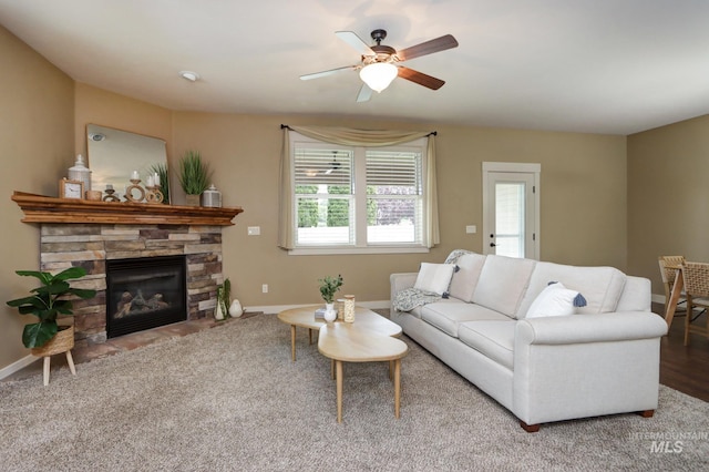 2018 S Sandcrest Loop, Nampa, ID 83686 - living area with plenty of natural light, a ceiling fan, a fireplace, and carpet floors