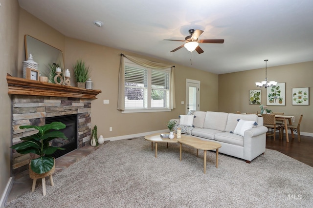 2018 S Sandcrest Loop, Nampa, ID 83686 - living area with ceiling fan, a fireplace, and a chandelier