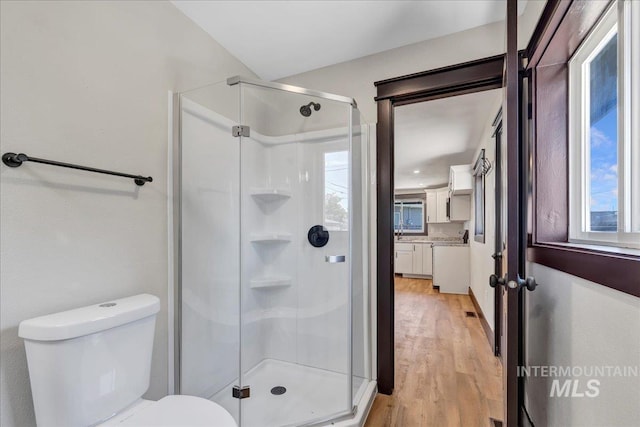 327 Adams St, Twin Falls, ID 83301 - full bath featuring a stall shower, wood finished floors, and healthy amount of natural light
