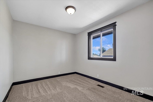 327 Adams St, Twin Falls, ID 83301 - empty room featuring baseboards and carpet
