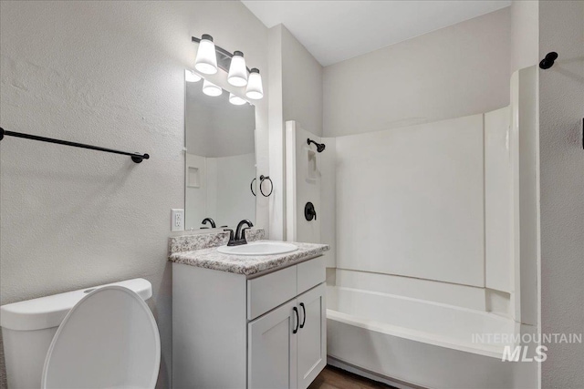 327 Adams St, Twin Falls, ID 83301 - full bathroom featuring vanity, bathing tub / shower combination, and a textured wall