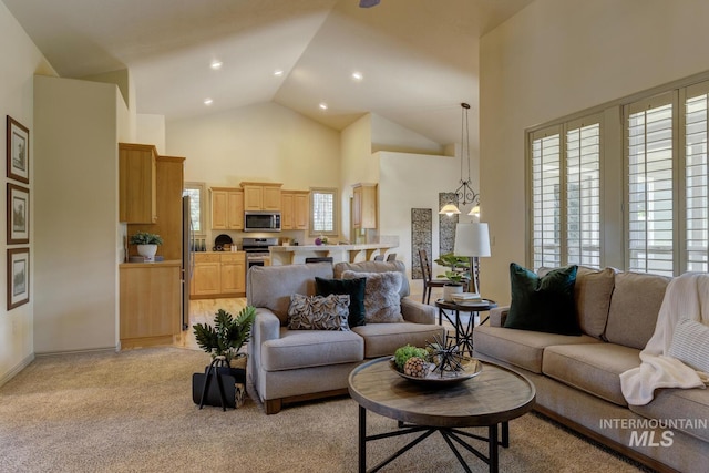 9407 W Pebblestream Dr, Boise, ID 83709 - living room featuring high vaulted ceiling, light colored carpet, and recessed lighting