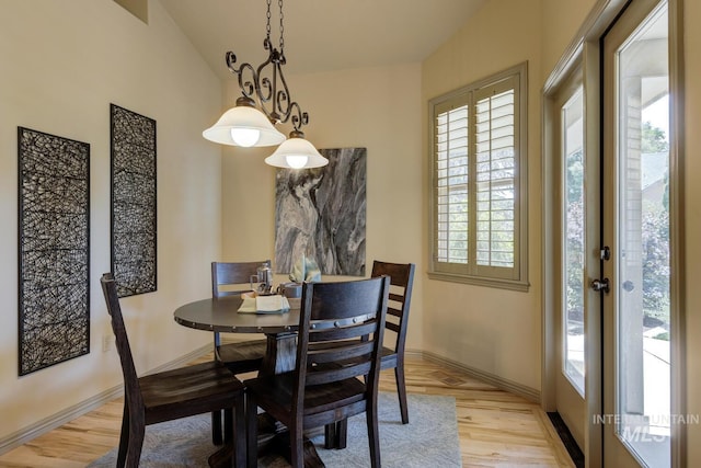 9407 W Pebblestream Dr, Boise, ID 83709 - dining space featuring light wood-style floors and baseboards