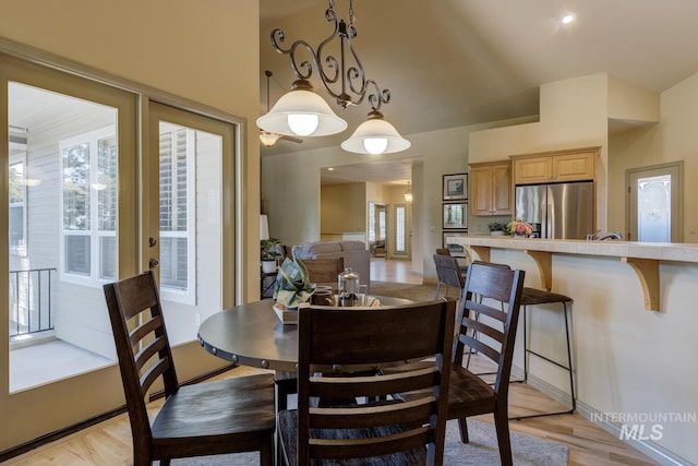 9407 W Pebblestream Dr, Boise, ID 83709 - dining area featuring light wood-style floors and lofted ceiling