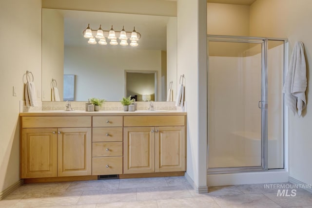 9407 W Pebblestream Dr, Boise, ID 83709 - full bathroom featuring a stall shower, double vanity, and tile patterned floors