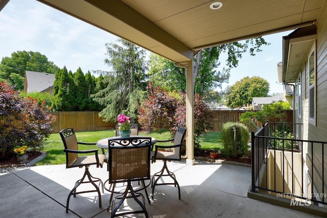 9407 W Pebblestream Dr, Boise, ID 83709 - fenced backyard with outdoor dining space and a patio area