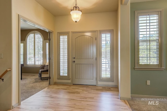9407 W Pebblestream Dr, Boise, ID 83709 - foyer entrance featuring wood finished floors