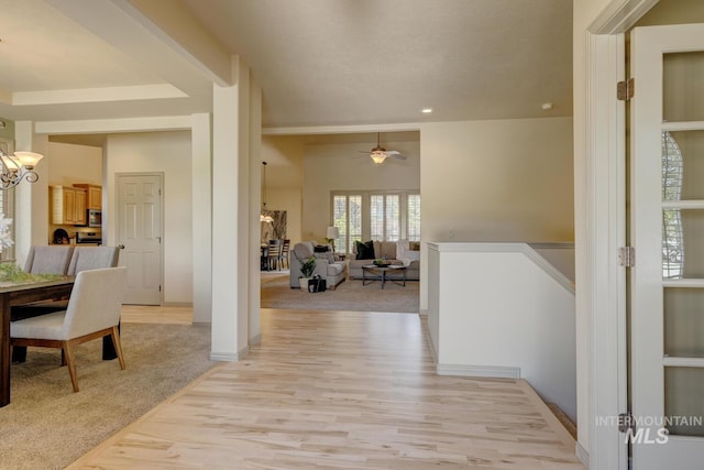 9407 W Pebblestream Dr, Boise, ID 83709 - hall featuring light wood-style flooring, a chandelier, and recessed lighting