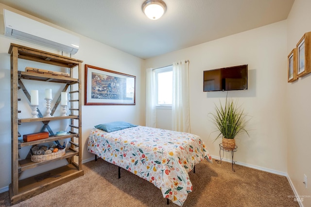 carpeted bedroom featuring baseboards and a wall mounted AC