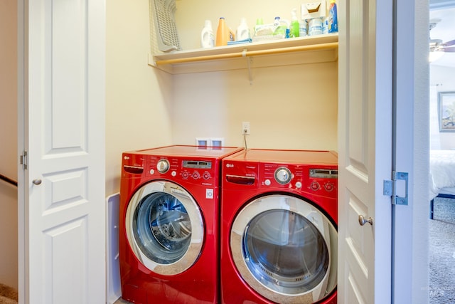 laundry area with laundry area and washing machine and clothes dryer