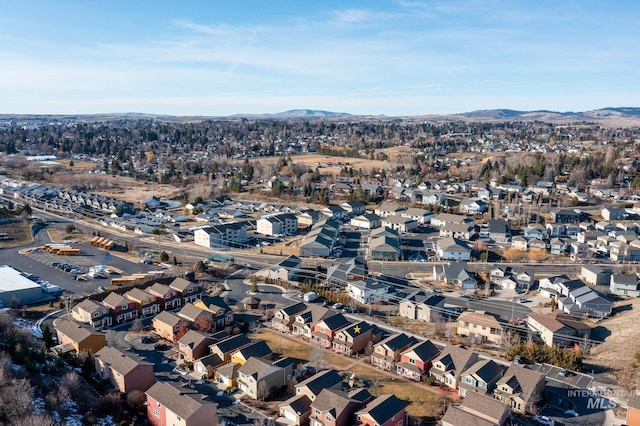 drone / aerial view featuring a residential view and a mountain view