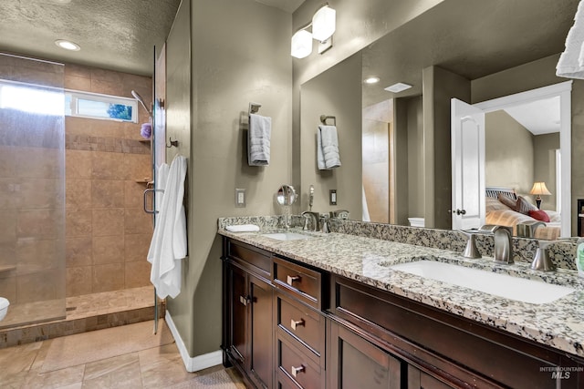 1390 E Prohaska Ct, Eagle, ID 83616 - bathroom featuring double vanity, a stall shower, ensuite bathroom, and a textured ceiling