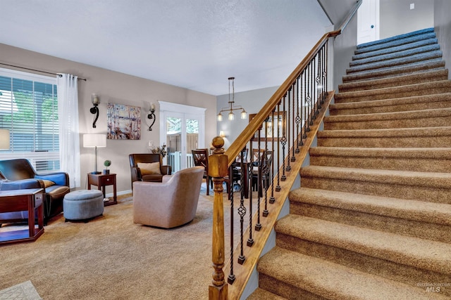 1390 E Prohaska Ct, Eagle, ID 83616 - staircase with carpet flooring and baseboards