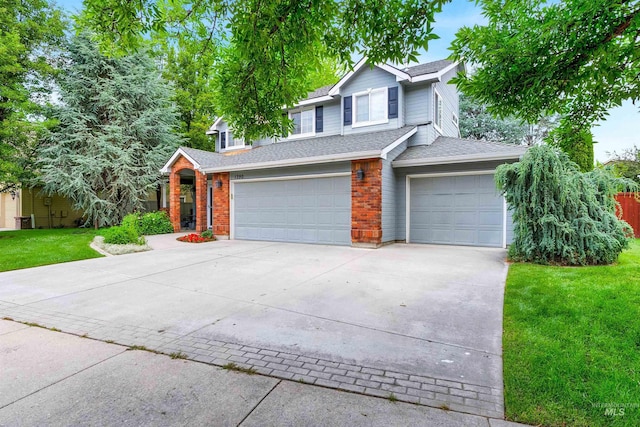 1390 E Prohaska Ct, Eagle, ID 83616 - traditional home with driveway, a front lawn, an attached garage, and brick siding