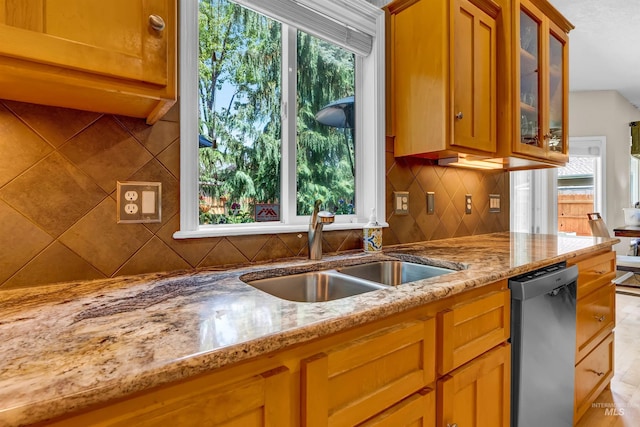 1390 E Prohaska Ct, Eagle, ID 83616 - kitchen with dishwasher, backsplash, light stone counters, and glass insert cabinets