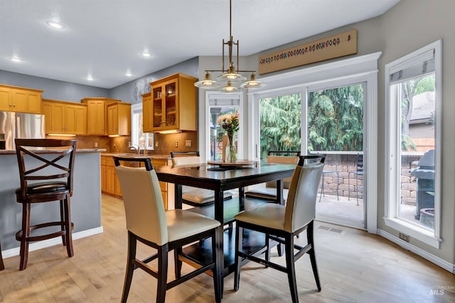 1390 E Prohaska Ct, Eagle, ID 83616 - dining room with plenty of natural light, light wood finished floors, and recessed lighting