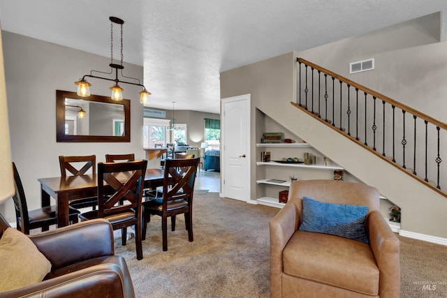 1390 E Prohaska Ct, Eagle, ID 83616 - living room with carpet flooring, built in shelves, and stairs