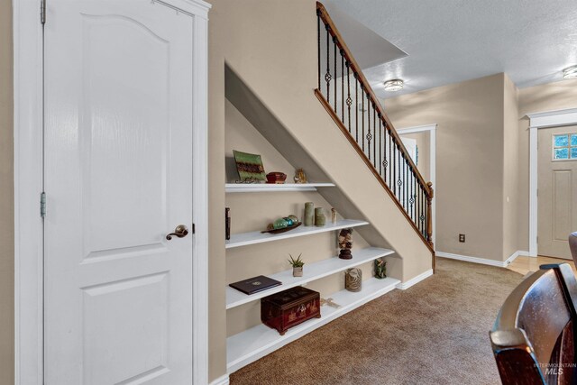 1390 E Prohaska Ct, Eagle, ID 83616 - entryway with carpet and stairs