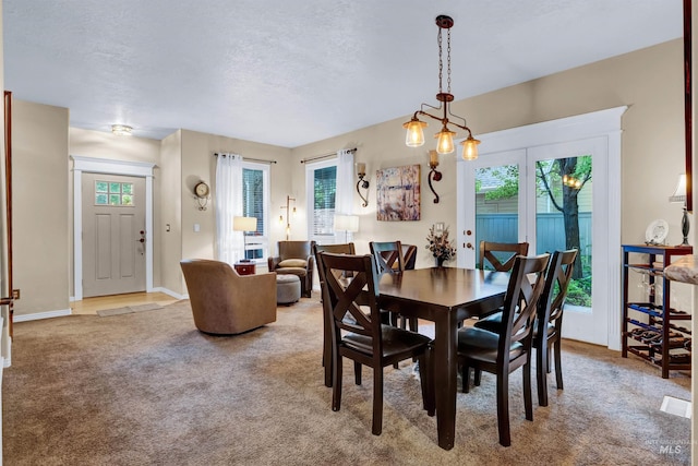 1390 E Prohaska Ct, Eagle, ID 83616 - carpeted dining room with healthy amount of natural light and a textured ceiling