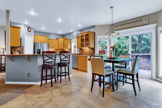 1390 E Prohaska Ct, Eagle, ID 83616 - dining space with healthy amount of natural light, recessed lighting, and light wood finished floors