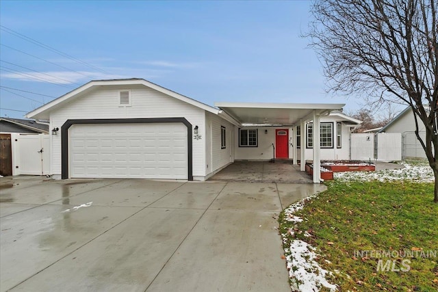 single story home featuring a carport and a garage