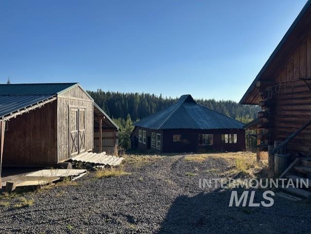 exterior space with a storage shed