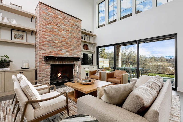 278 S Carbon Rivet Ave, Eagle, ID 83616 - living area featuring a high ceiling, wood finished floors, and a fireplace