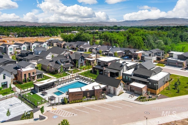 278 S Carbon Rivet Ave, Eagle, ID 83616 - aerial perspective of suburban area with a pool and a mountainous background
