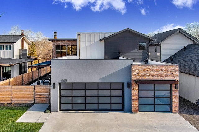 278 S Carbon Rivet Ave, Eagle, ID 83616 - modern home featuring driveway, board and batten siding, brick siding, a garage, and stucco siding