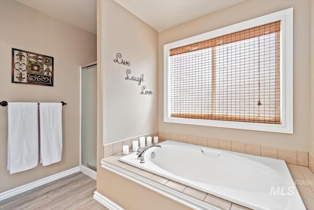 3499 S Green Basin Way, Nampa, ID 83686 - bathroom featuring a garden tub, a stall shower, and wood finished floors